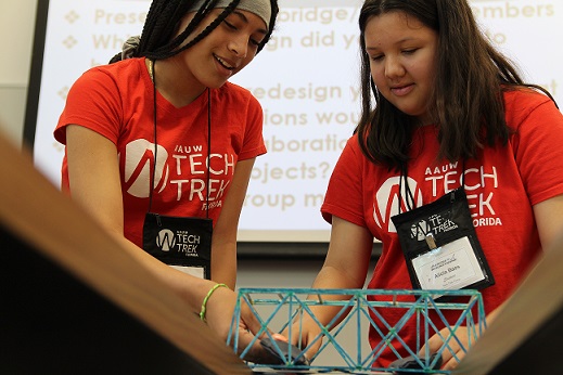 Tech Trek Camper Alicia Bass (right) building a bridge
